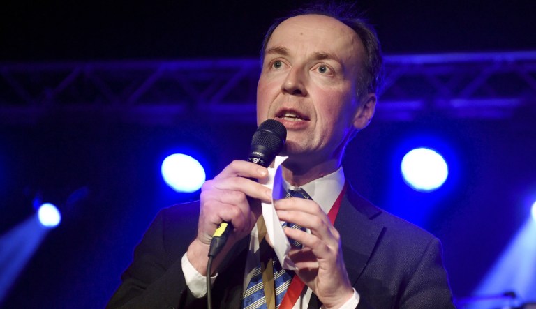 Jussi Halla-aho, the new leader of the Finns Party, makes an address during the party's congress in Jyv'skyl', Finland, Saturday June 10, 2017.