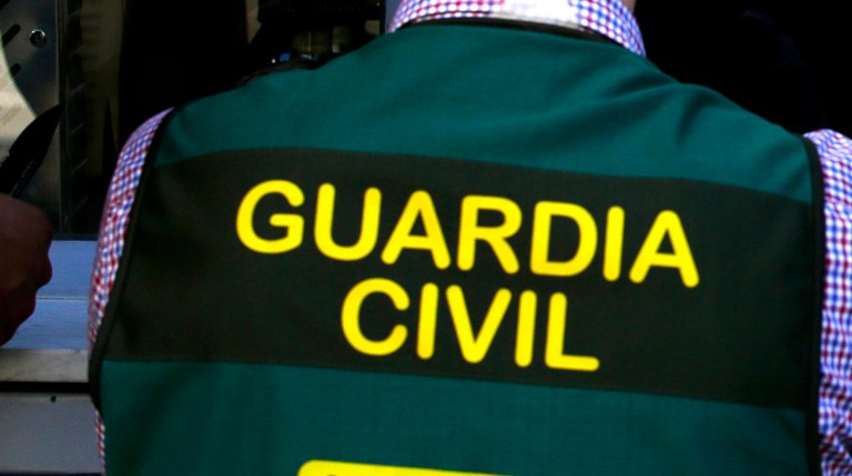 Spanish Guardia Civil members seal off a restaurant during a police operation in Barcelona, Spain, in 2017.