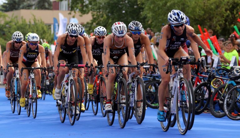 Renee Tomlin of the United States, right, and Maaike Caelers of the Netherlands, third right, compete in the women's cycling event of the ITU Triathlon World Cup Series in Tiszaujvaros, 180 kms northeast of Budapest, Hungary, Sunday, July 23, 2017.