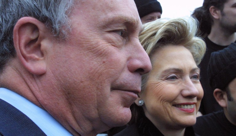 In this March 3, 2002 file photo, then-New York Mayor Michael Bloomberg, left, and then-Sen. Hillary Rodham Clinton, D-N.Y., attend the St. Patrick's Day parade in the Queens borough of New York. 