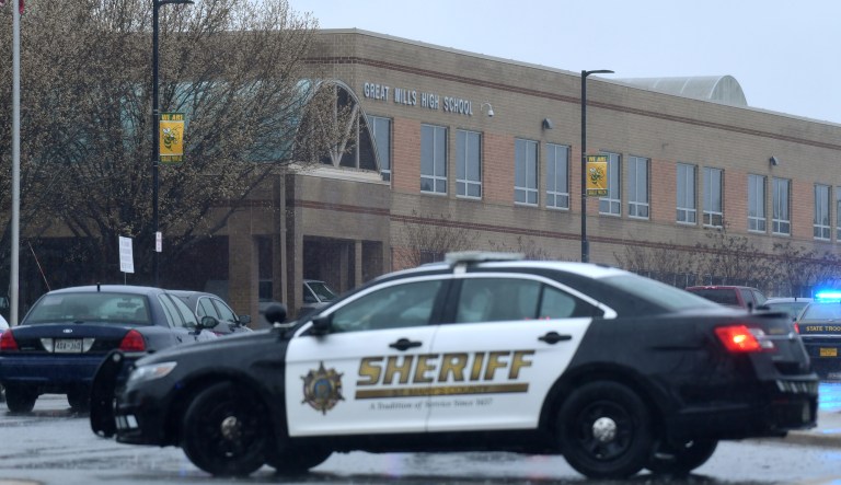 Deputies, federal agents and rescue personnel, converge on Great Mills High School, the scene of a shooting, Tuesday morning, March 20, 2018 in Great Mills, Md.