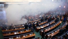 Kosovo opposition party drops smoke bombs in parliament to thwart vote on border deal