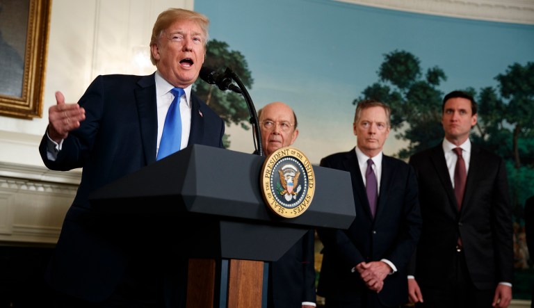 President Trump speaks before signing a Presidential Memorandum imposing tariffs and investment restrictions on China, in the Diplomatic Reception Room of the White House, Thursday, March 22, 2018, in Washington. From left, Trump, Secretary of Commerce Wilbur Ross, United States Trade Representative Robert Lighthizer, and White House homeland security adviser Tom Bossert. 