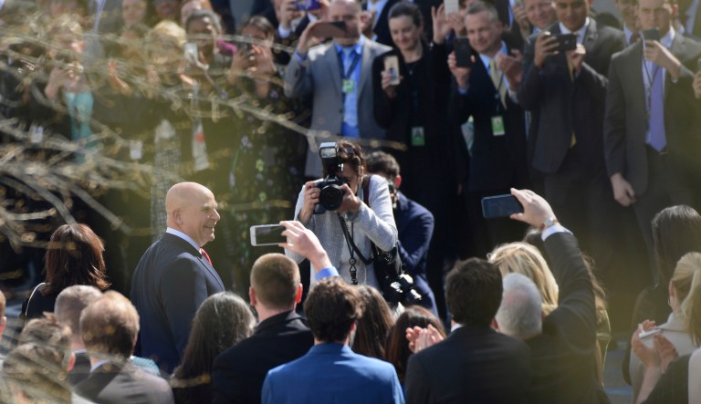 Outgoing national security adviser H.R. McMaster walks out of the West Wing of the White House in Washington, Friday, on his last day as he is applauded by staff. 