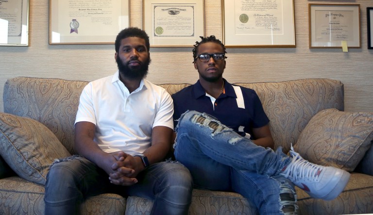 Rashon Nelson, left, and Donte Robinson, right, both 23, sit on their attorney's sofa. Their arrests at a local Starbucks quickly became a viral video and galvanized people around the country who saw the incident as modern-day racism. 