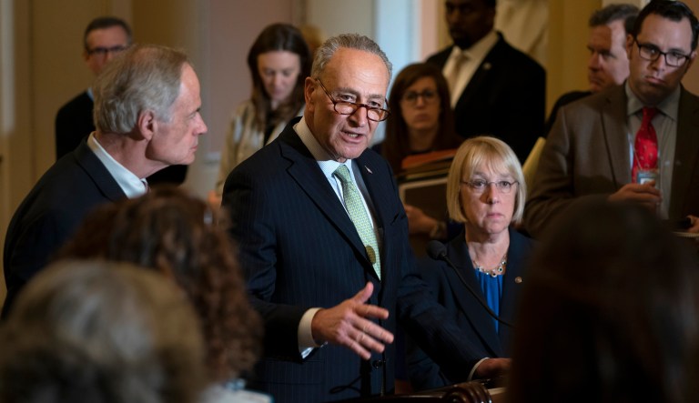 Senate Minority Leader Chuck Schumer, D-N.Y., flanked by Sen. Tom Carper, D-Del., left, and Sen. Patty Murray, D-Wash., speaks during a news conference. 