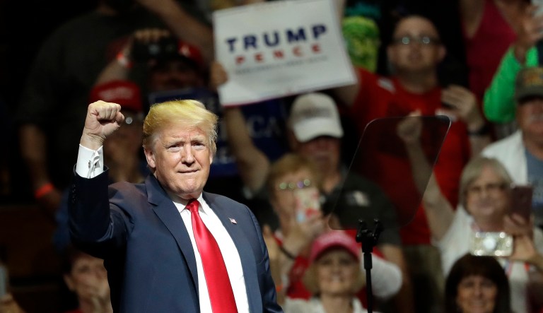 President Trump acknowledges the crowd's applause during a Republican campaign rally. 