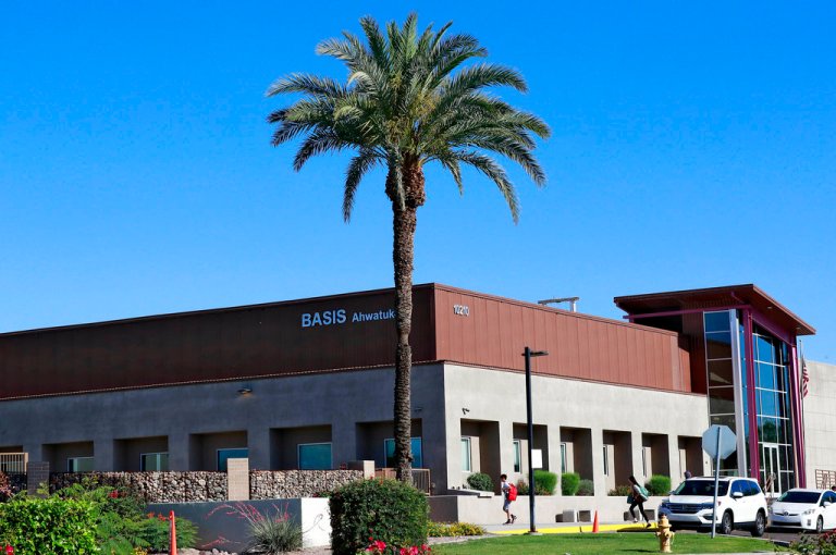 Students arrive at Basis Charter School Thursday, May 10, 2018 in Phoenix. (AP Photo/Matt York_