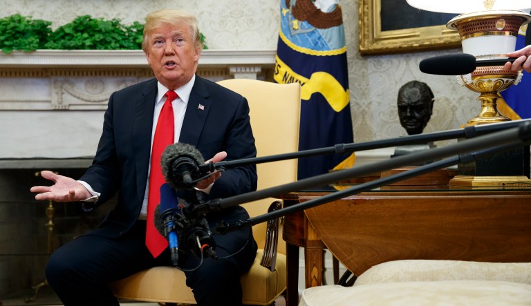 President Trump speaks during a meeting in the Oval Office of the White House. 
