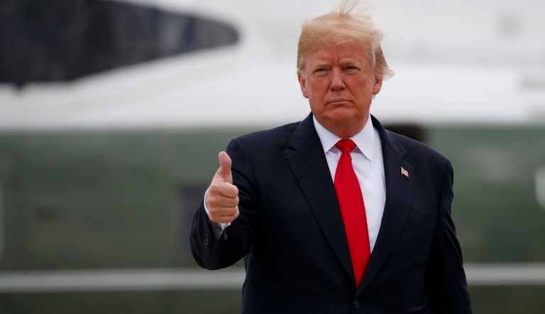 President Trump boards Air Force One for a trip to New York to discuss immigration policy. 
