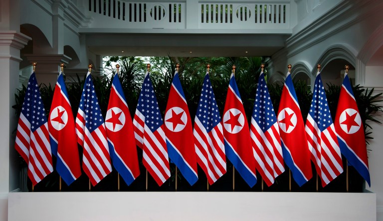 Flags are in place before President Trump meets with North Korean leader Kim Jong Un on Sentosa Island in Singapore. 
