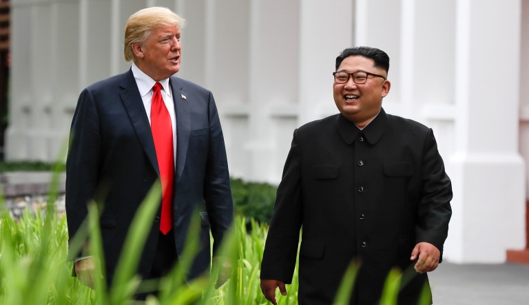 President Trump and North Korea leader Kim Jong Un walk from their lunch at the Capella resort on Sentosa Island in Singapore. 