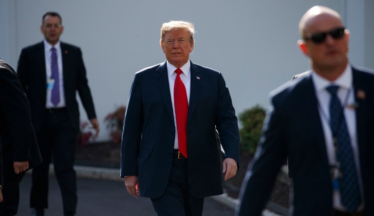 President Trump walks to an interview on the North Lawn of the White House. 
