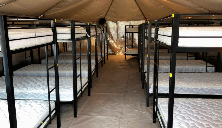Hundreds of migrant children moved to Texas tent camp