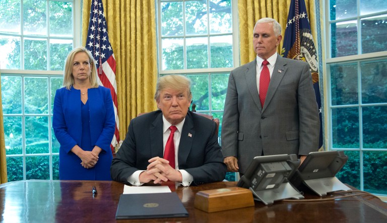 President  Trump, with Homeland Security Secretary Kirstjen Nielsen, and Vice President Mike Pence, before signing an executive order to end family separations at the border.