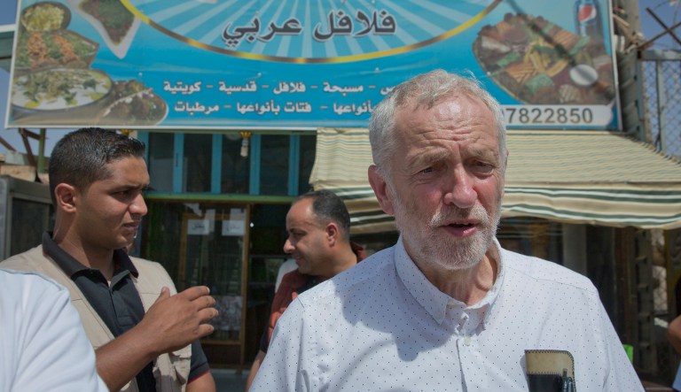 United Kingdom's Labour party leader Jeremy Corbyn walks in the main market road during his visit to the Zaatari Syrian Refugee Camp, in Mafraq, Jordan. 