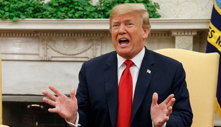 President Trump speaks during a meeting in the Oval Office of the White House.