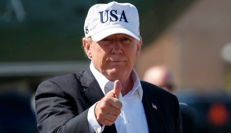President Trump give the thumbs-up as he walks from Marine One to board Air Force One at Morristown Municipal Airport, in Morristown, N.J.