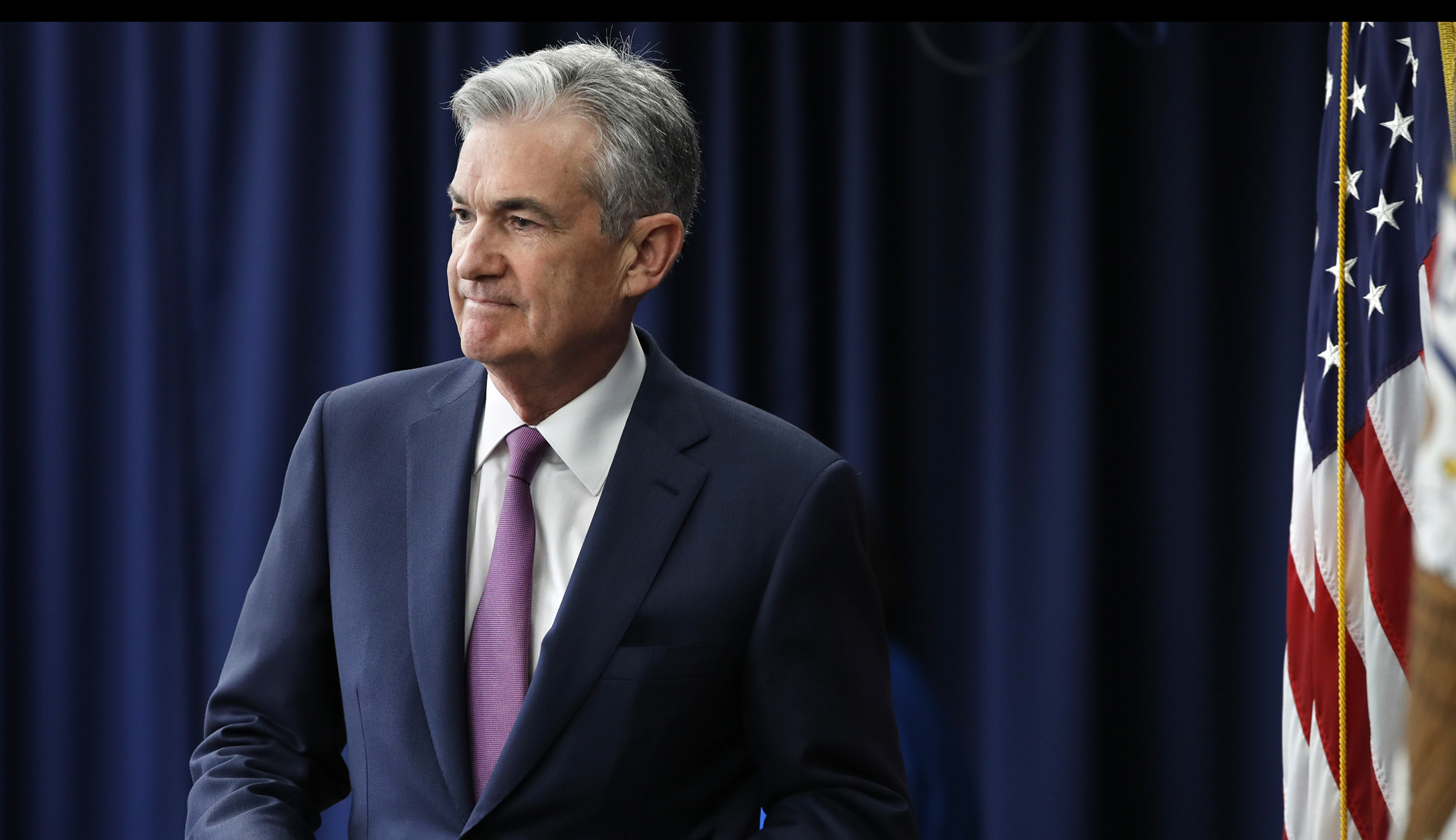 Fed leaves interest rates alone, resisting Trump’s pressure for a cut