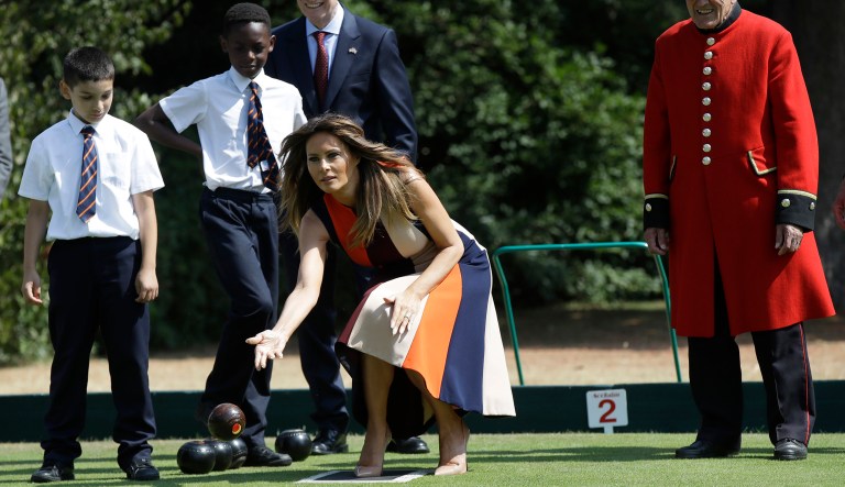 First lady Melania Trump plays bowls and meets British military veterans known as "Chelsea Pensioners" at The Royal Hospital Chelsea in central London Friday.