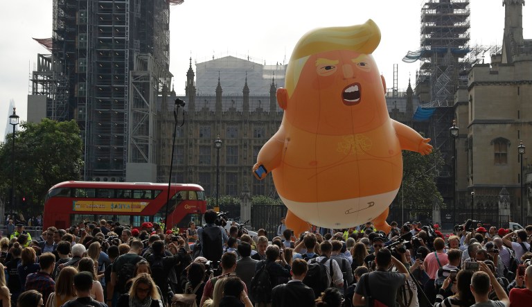A six-meter high cartoon baby blimp of President Trump is flown as a protest against his visit, in Parliament Square backdropped by the scaffolded Houses of Parliament and Big Ben in London. 