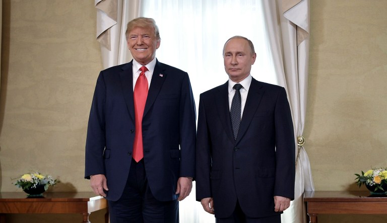 President Trump and Russian President Vladimir Putin pose for a photograph at the Presidential Palace in Helsinki. 