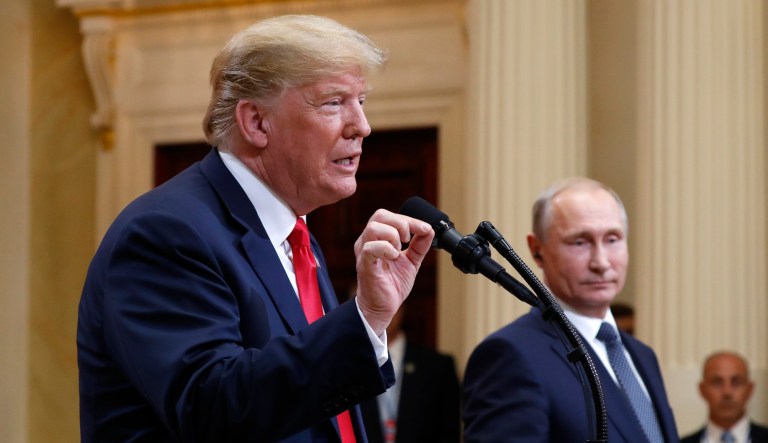 President Trump speaks with Russian President Vladimir Putin during a press conference after their meeting in Helsinki. 