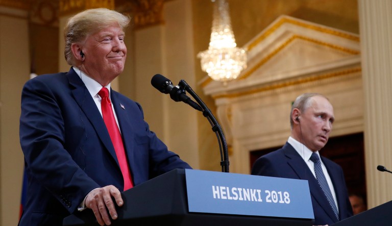 President Trump smiles beside Russian President Vladimir Putin during a press conference after their meeting at the Presidential Palace in Helsinki. 