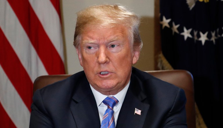 President Trump pauses during his meeting with members of his Cabinet in the Cabinet Room of the White House. 