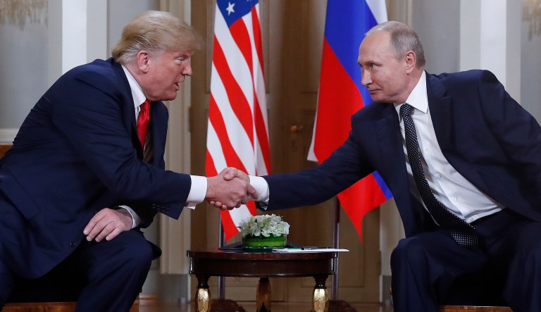 President Trump and Russian President Vladimir Putin shake hands at the beginning of a meeting at the Presidential Palace in Helsinki, Finland, on July 16, 2018.