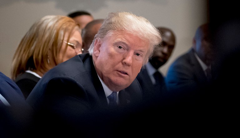 President Trump listens during a meeting in the Cabinet Room of the White House in Washington on Aug. 1, 2018.