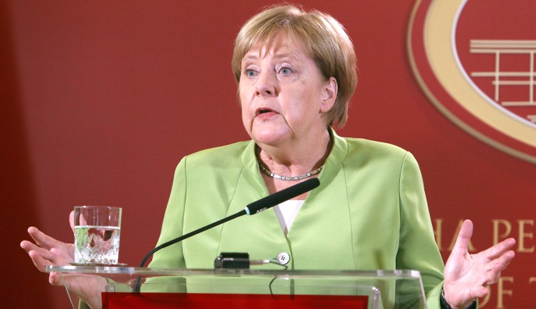 German Chancellor Angela Merkel talks to the media during a news conference. 