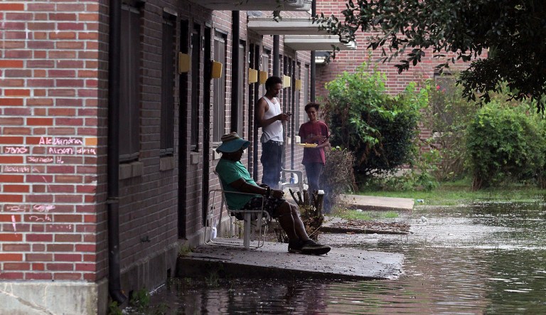 Residents wait out the weather as rising waters get closer to their doors in New Bern, N.C. Hurricane Florence already has inundated coastal streets with ocean water and left tens of thousands without power, and more is to come.  