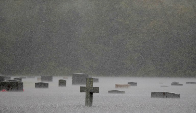 A flooded cemetery is seen during heavy rains from Florence in Marion, S.C. Downgraded overnight to a tropical depression, Florence was still massive.