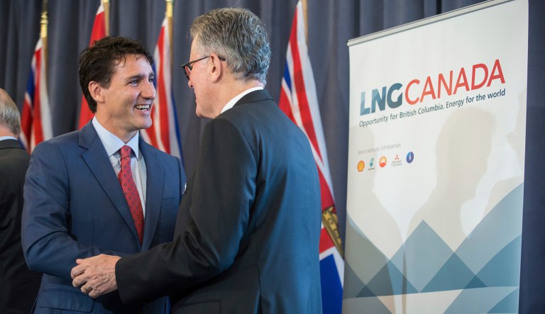 Prime Minister Justin Trudeau and LNG Canada CEO Andy Calitz speak after an LNG Canada news conference in Vancouver on Tuesday, Oct. 2, 2018.