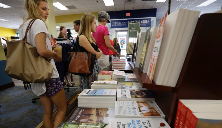 In this Aug. 19, 2015, file photo people shop at the newly opened Barnes & Noble book store in Campus Town at The College of New Jersey in Ewing Township, N.J. The board of Barnes & Noble said Wednesday, Oct. 3, 2018, it is reviewing the company's future after several parties expressed interest in buying it.