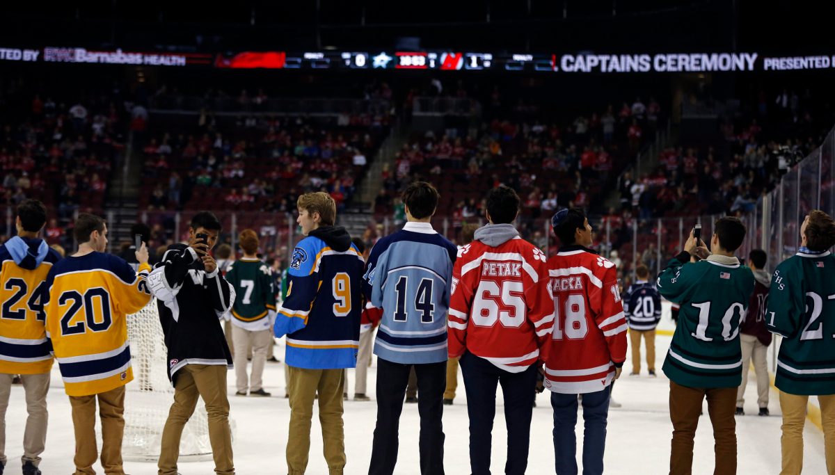 High school slammed as racist after elementary-age hockey fans flash 'OK' symbol