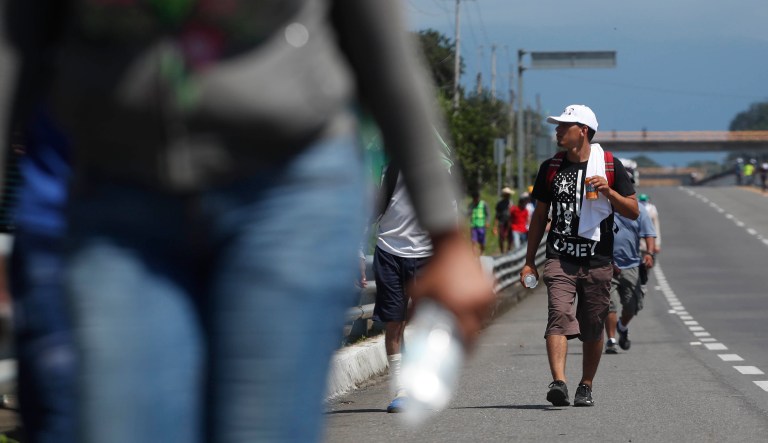 Central American migrants making their way to the U.S. arrive by foot to Tapachula, Mexico, Sunday, Oct. 21, 2018.