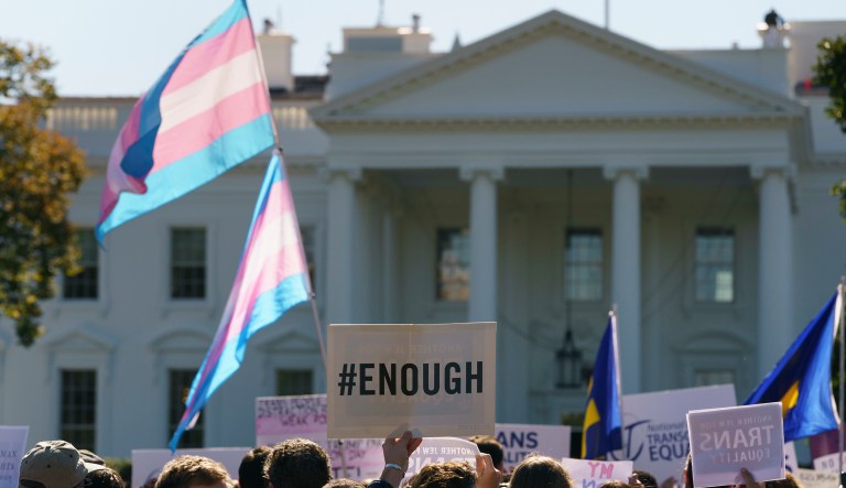 The National Center for Transgender Equality, NCTE, and the Human Rights Campaign gather on Pennsylvania Avenue in front of the White House in Washington, Monday, Oct. 22, 2018, for a #WontBeErased rally.