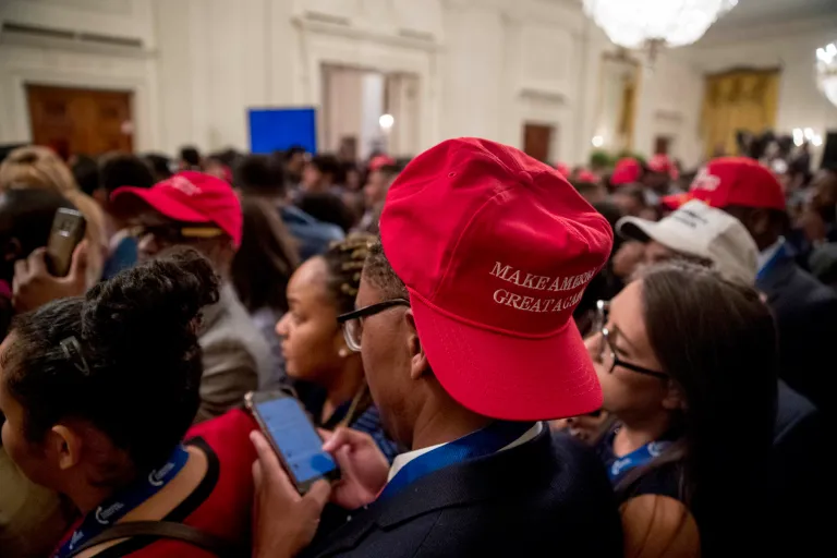 Members of the audience wait for President Donald Trump to arrive at the 2018 Young Black Leadership Summit in the East Room of the White House, Friday, Oct. 26, 2018, in Washington.