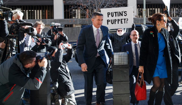 President Trump's former national security adviser Michael Flynn and his wife Lori Andrade arrive at federal court in Washington, Tuesday, Dec. 18, 2018. 
