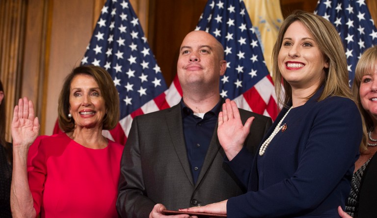 House Speaker Nancy Pelosi of California, right, poses during a ceremonial swearing-in with Rep. Katie Hill, D-Calif., on Capitol Hill in Washington, Thursday, Jan. 3, 2019, during the opening session of the 116th Congress. 