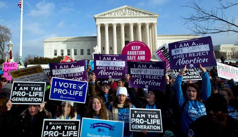Anti-abortion activists protest outside of the U.S. Supreme Court, during the March for Life in Washington Friday, Jan. 18, 2019.