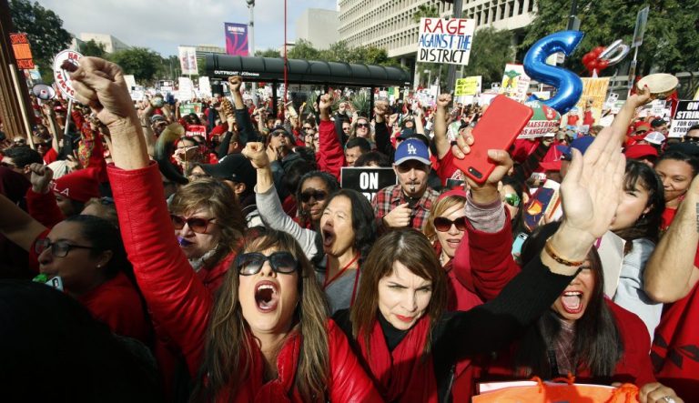 Educators rally as a strike against the Los Angeles Unified School District entered its fifth day outside City Hall in Los Angeles Friday, Jan. 18, 2019. Clashes over pay, class sizes, and support-staff levels in the district led to its first strike in 30 years and prompted the staffing of classrooms with substitute teachers and administrators.