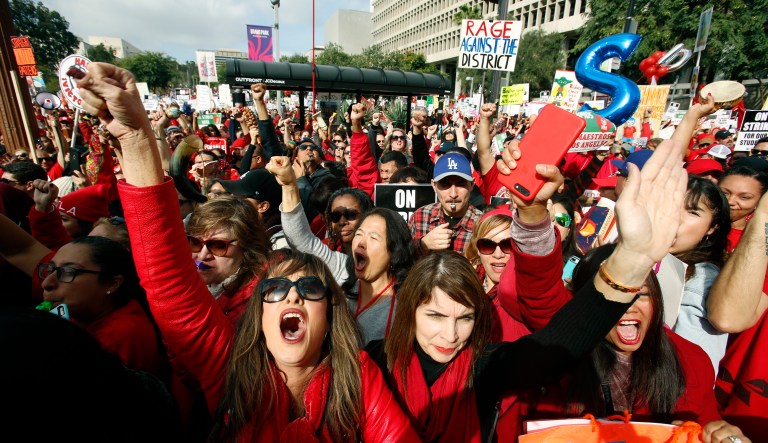 Educators rally as a strike against the Los Angeles Unified School District entered its fifth day outside City Hall in Los Angeles Friday, Jan. 18, 2019. Clashes over pay, class sizes, and support-staff levels in the district led to its first strike in 30 years and prompted the staffing of classrooms with substitute teachers and administrators.