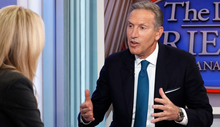 In this Wednesday, Jan. 30, 2019, file photo former Starbucks CEO Howard Schultz is interviewed by FOX News Anchor Dana Perino for her "The Daily Briefing" program, in New York. Schultz spent more than 30 years at Starbucks, growing a handful of coffee shops into a much-admired global brand. But now, as the billionaire mulls running for president as an independent, Starbucks will have to tread carefully.