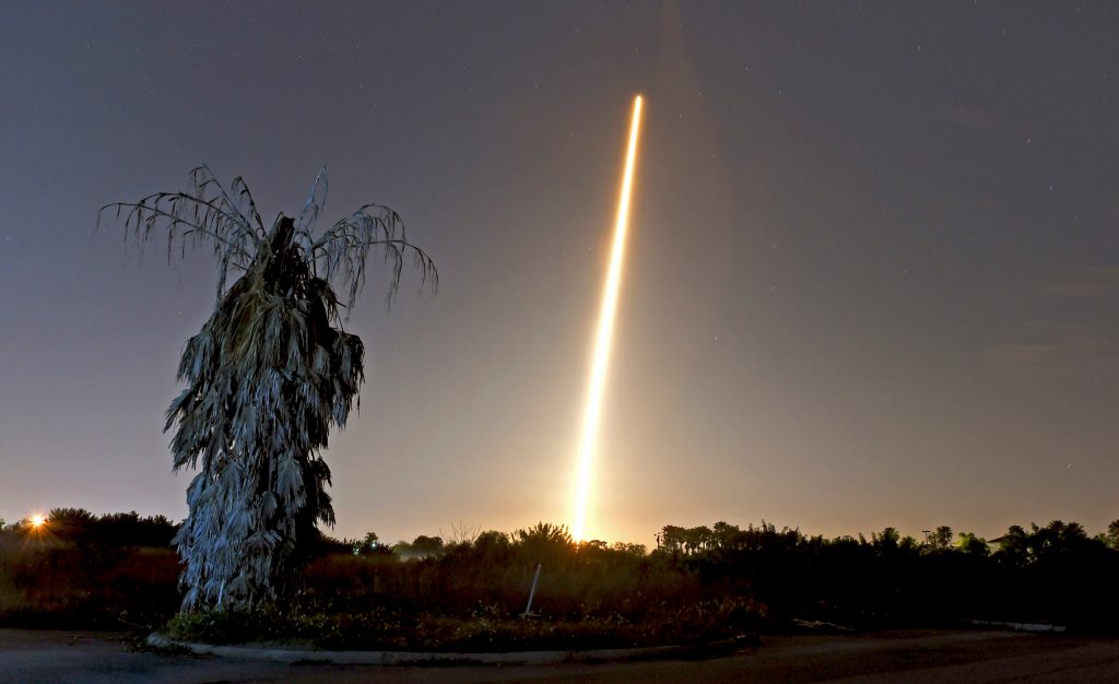 Crew capsule rockets toward space station with test dummy