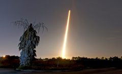 Crew capsule rockets toward space station with test dummy