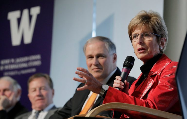 Christine Todd Whitman, right, the former Republican Governor of New Jersey and former Administrator of the Environmental Protection Agency, speaks as Washington Gov. Jay Inslee, left, looks on, Wednesday, March 6, 2019, during a non-partisan panel discussion titled "Foreign Affairs and National Security in the Age of Climate Change" hosted by the University of Washington Jackson School and the American Security Project on the UW campus in Seattle. (AP Photo/Ted S. Warren)