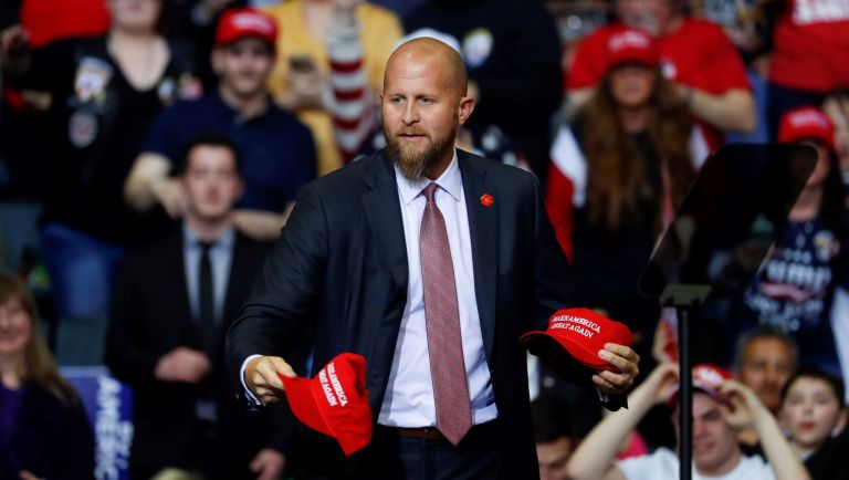 Brad Parscale, manager of President Donald Trump's reelection campaign, throws Make America Great Again hats to the audience before a rally in Grand Rapids, Mich., Thursday, March 28, 2019.